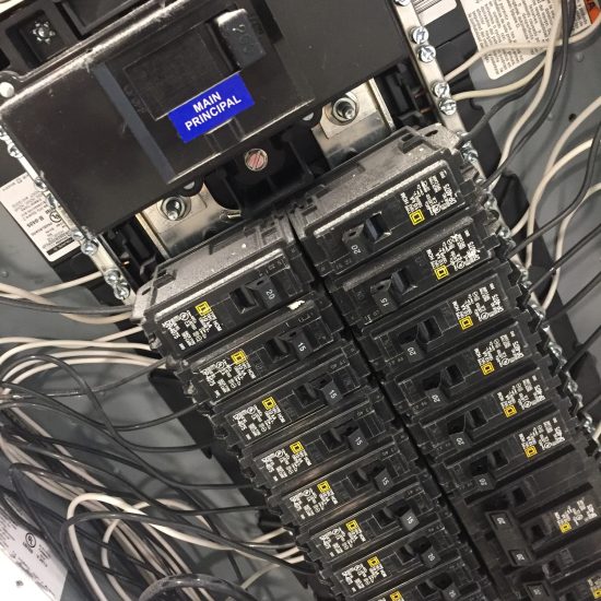 Circuit breaker electric panel box with wires in a residential home or house Circuit breaker electric panel box with wires in a residential home or house